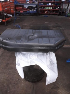 Fuel tank gets its top coat prior to installation.