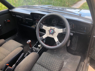 The Raid Turbo steering wheel, wooden gear knob &amp; window winder inserts and the black/green upholstery are all original factory-fit.