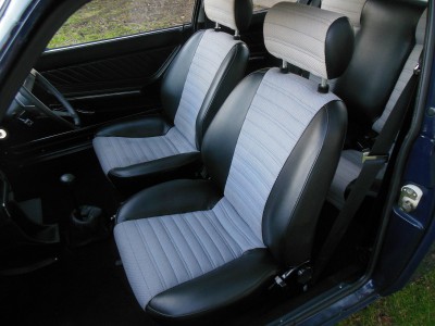 Shadows on drivers seat are just damp patches from when the vendor washed the car to take the pics.  They do not show in other close up's I have seen.