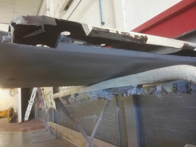 Rusty metal cut out ready for the repair panel to be let in